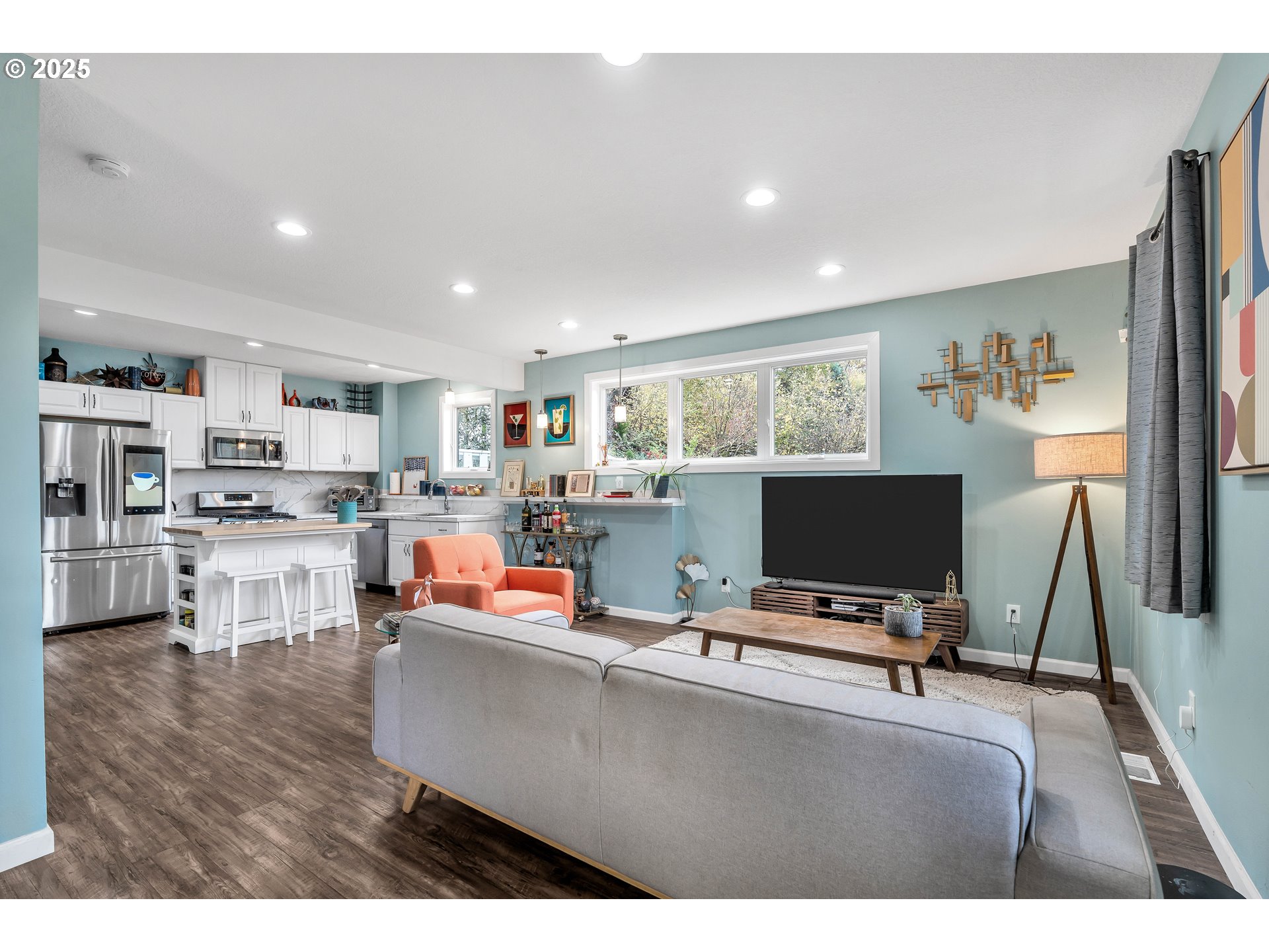 704 3rd Avenue Oregon City, OR 97045 - Photo 11 of 48 a living room with furniture and a flat screen tv