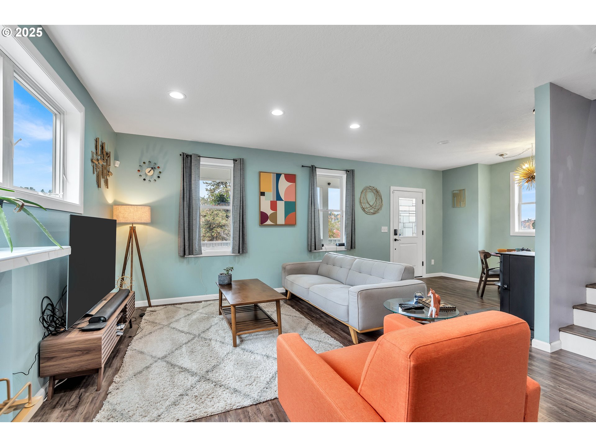 704 3rd Avenue Oregon City, OR 97045 - Photo 12 of 48 a living room with furniture a flat screen tv and a window