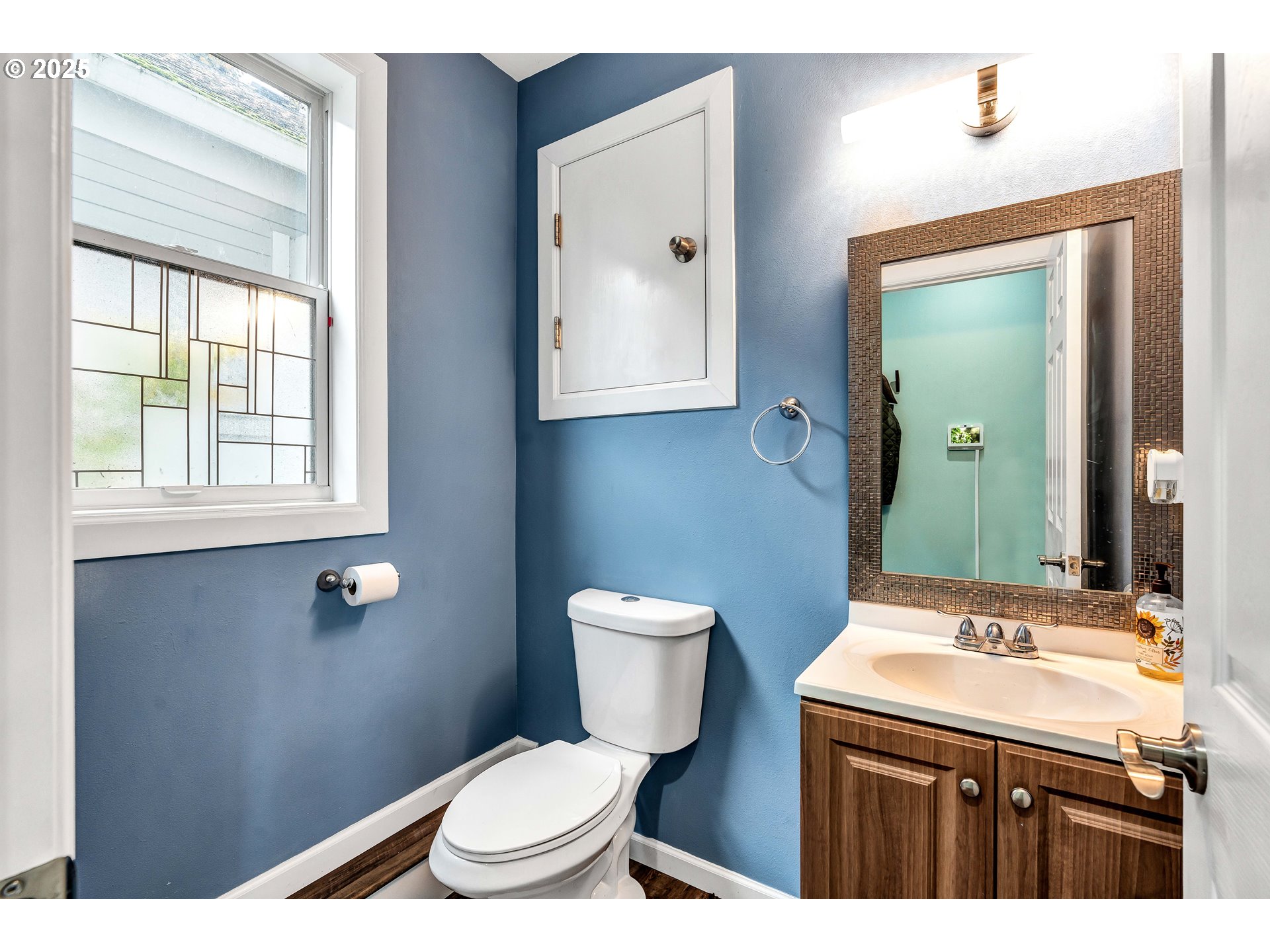 704 3rd Avenue Oregon City, OR 97045 - Photo 15 of 48 a bathroom with a granite countertop toilet sink and mirror