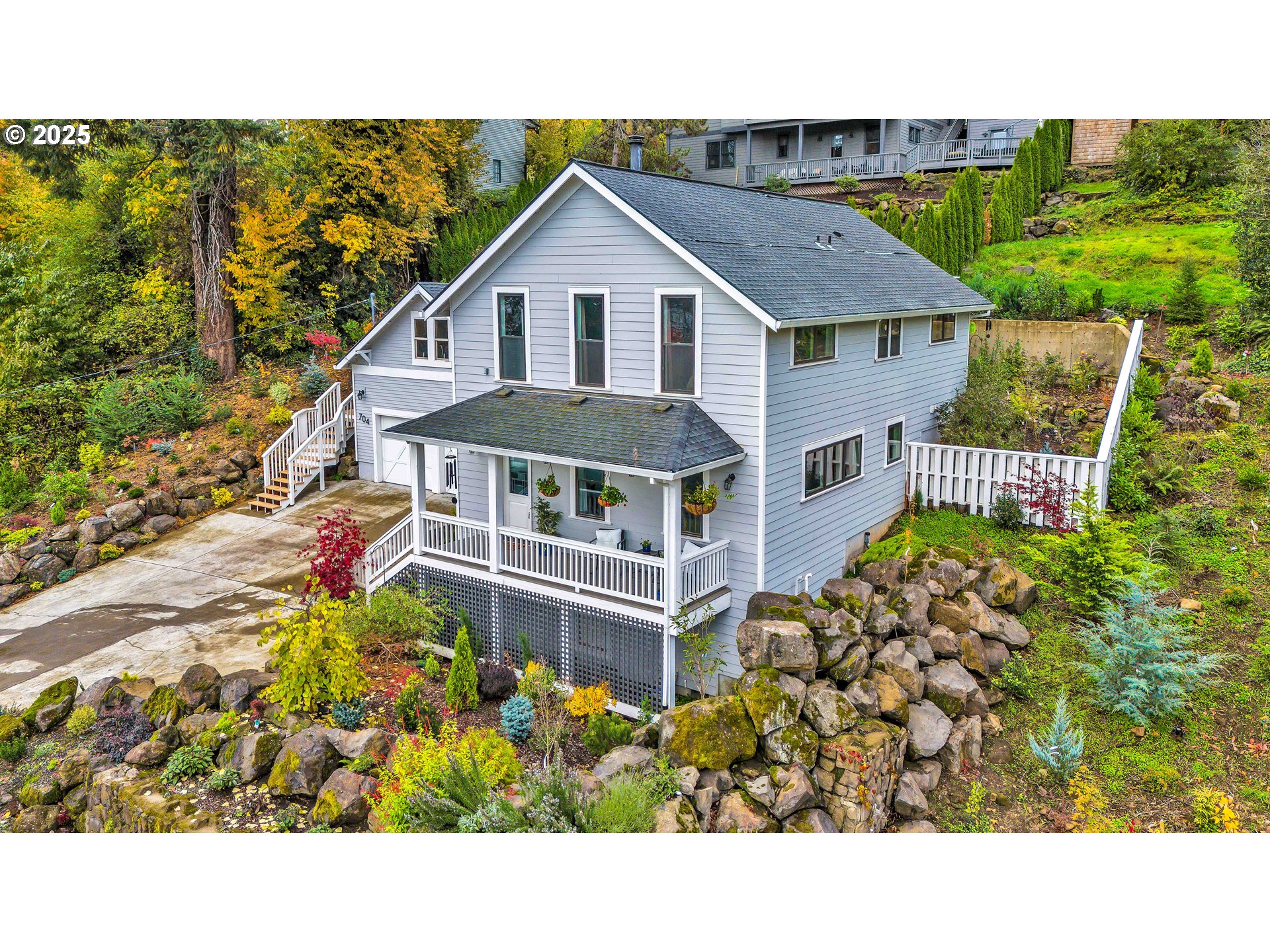 704 3rd Avenue Oregon City, OR 97045 - Photo 2 of 48 a view of a house with a garden