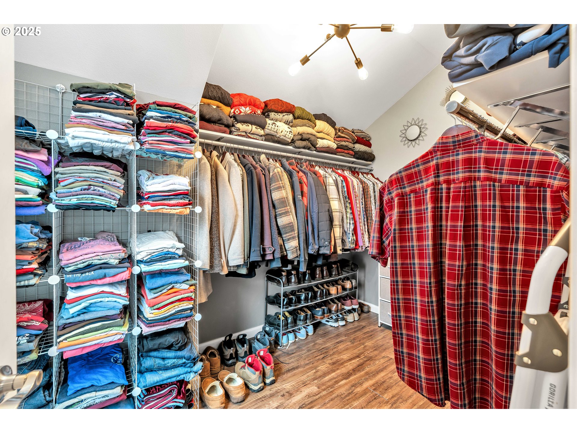 704 3rd Avenue Oregon City, OR 97045 - Photo 24 of 48 a view of walk in closet and clothes