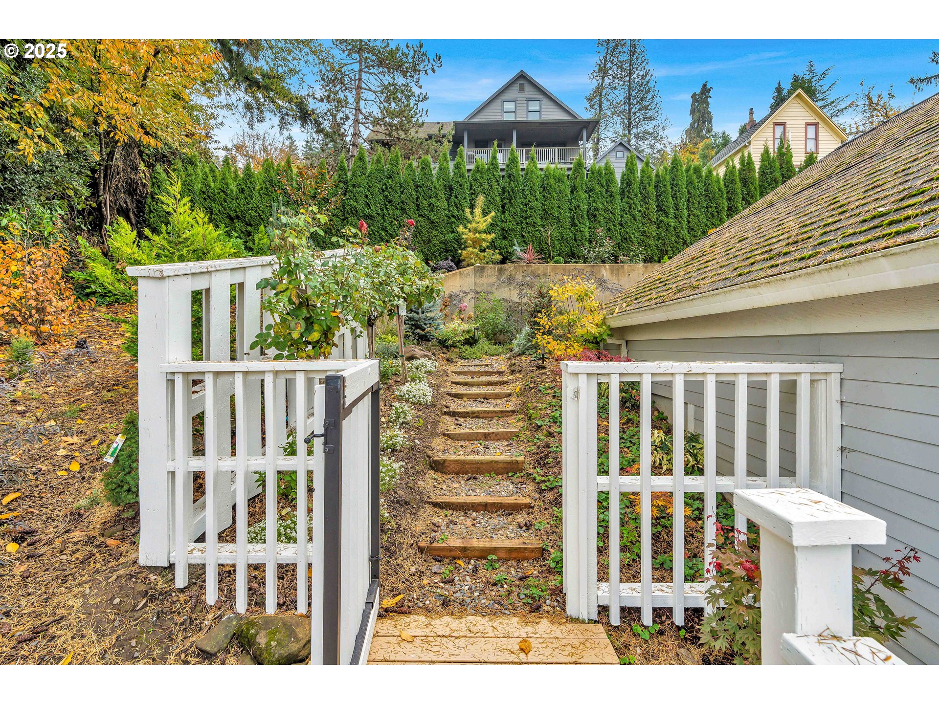 704 3rd Avenue Oregon City, OR 97045 - Photo 32 of 48 a view of a house with backyard and sitting area