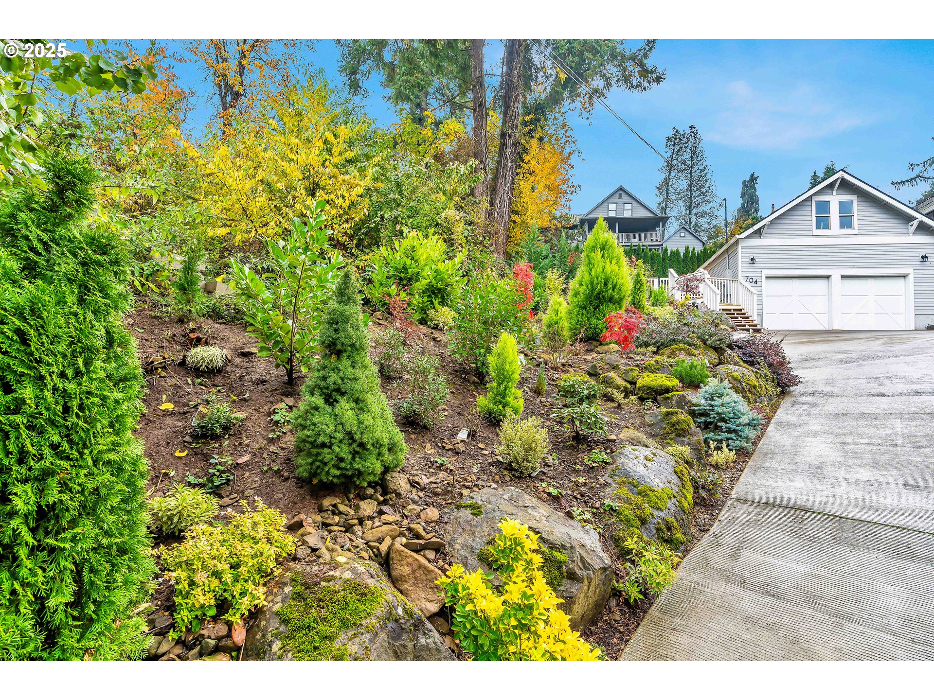 704 3rd Avenue Oregon City, OR 97045 - Photo 45 of 48 a view of a house with a yard and garden