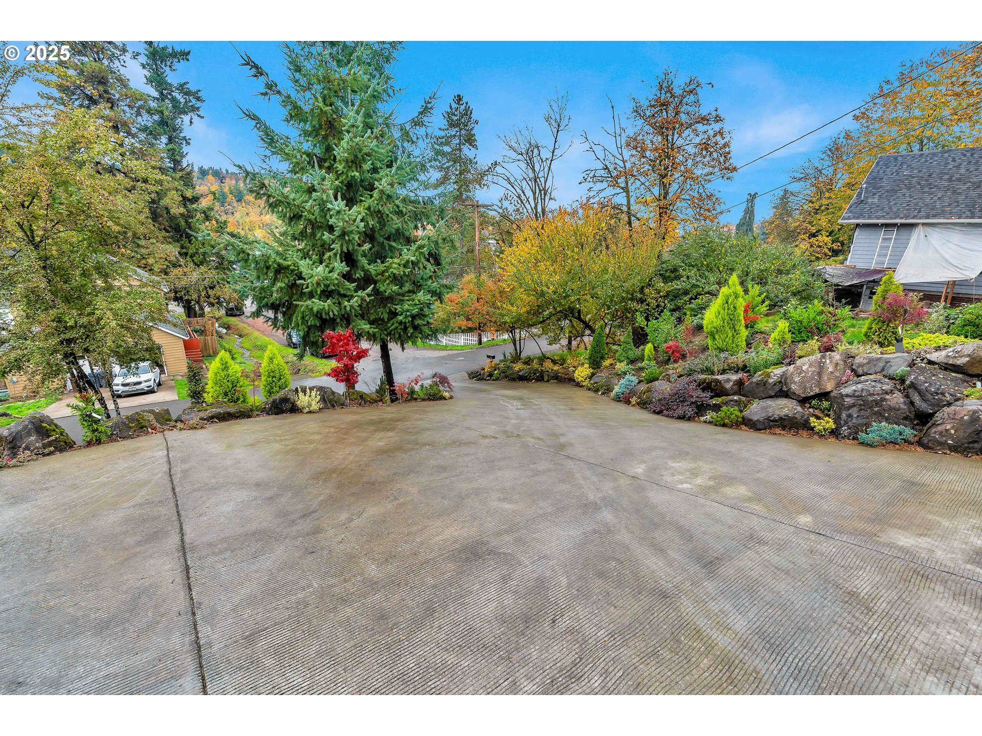 704 3rd Avenue Oregon City, OR 97045 - Photo 5 of 48 a view of a garden with a bench