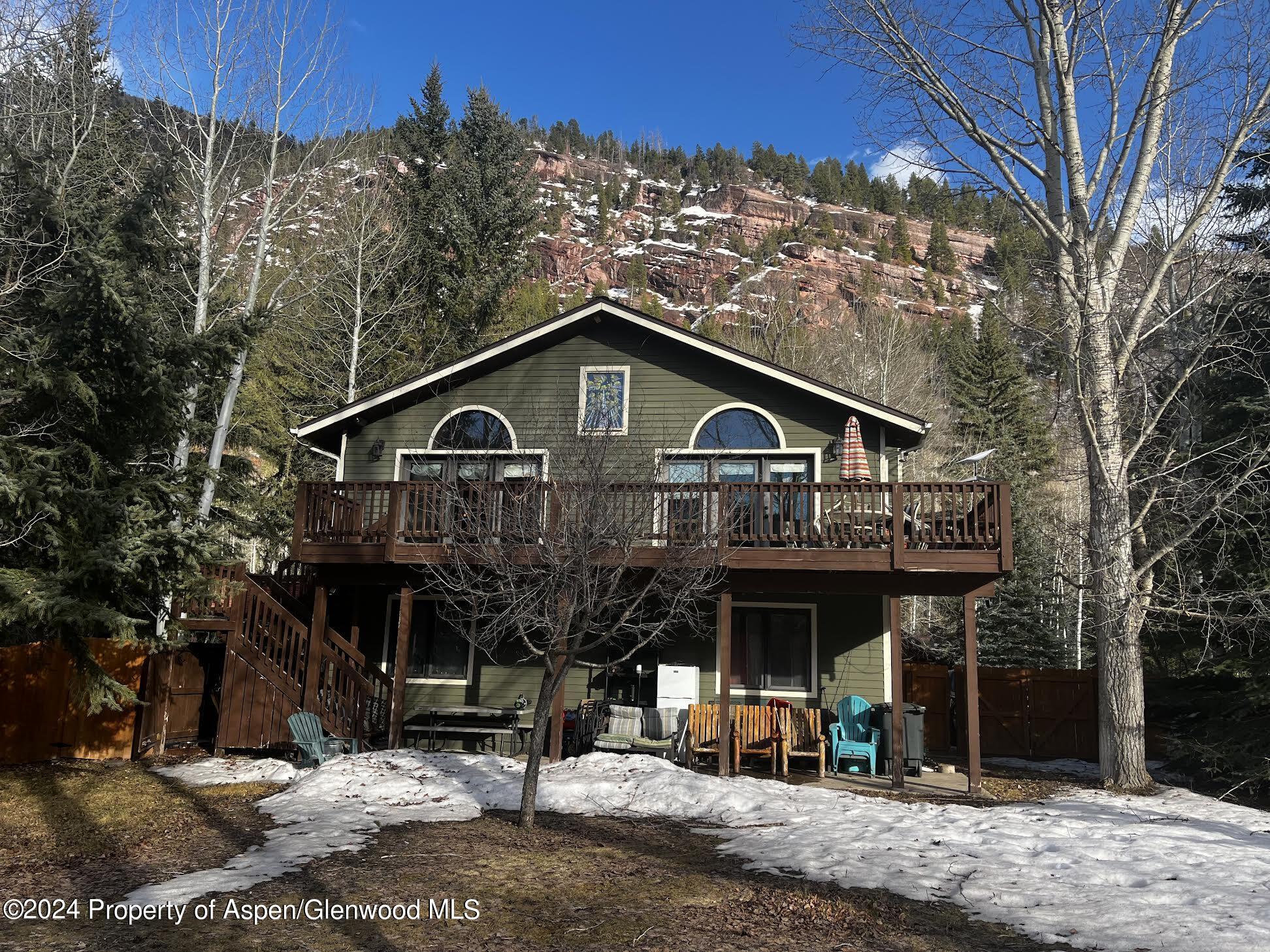 479 Redstone Boulevard Redstone, CO 81623 - Photo 4 of 5 a view of a house with a yard and balcony