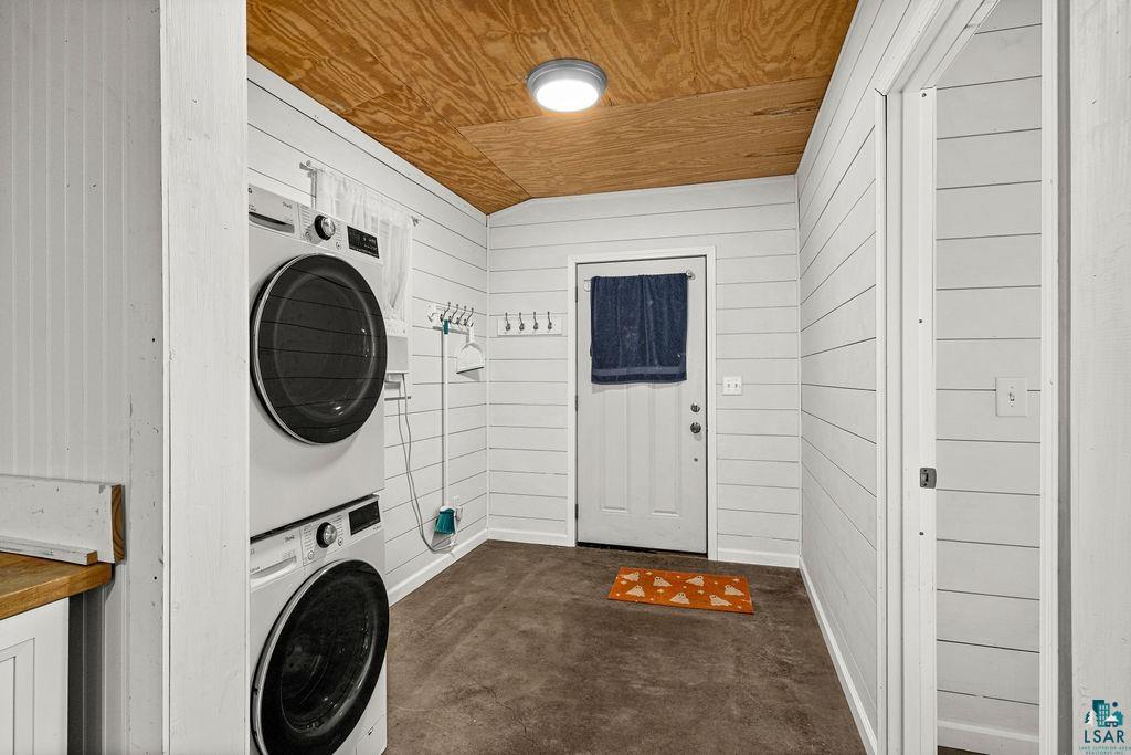 1159 Wales Road Two Harbors, MN 55616 - Photo 11 of 29 Laundry area featuring white shiplap walls, wood-finish ceiling, and durable concrete flooring