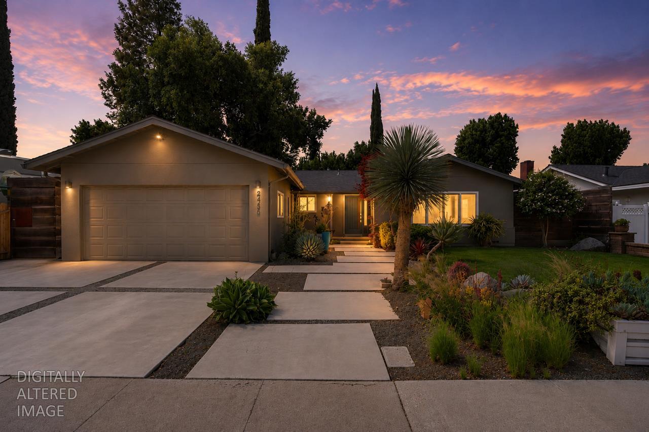 2424 Killarney Way Modesto, CA 95355 - Photo 2 of 30 a front view of a house with a yard and potted plants