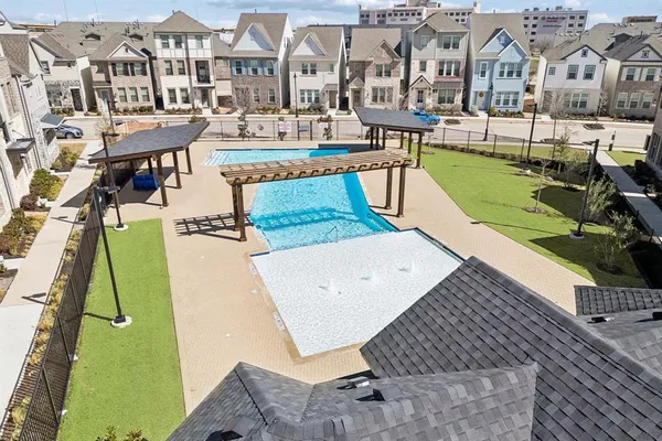a view of a swimming pool with a lounge chairs