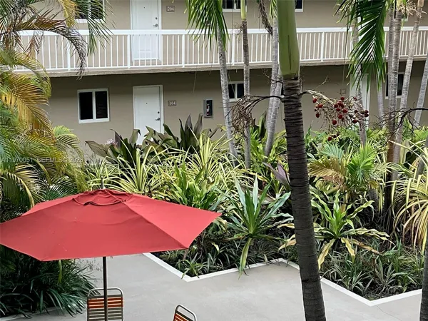 a view of a house with balcony and garden