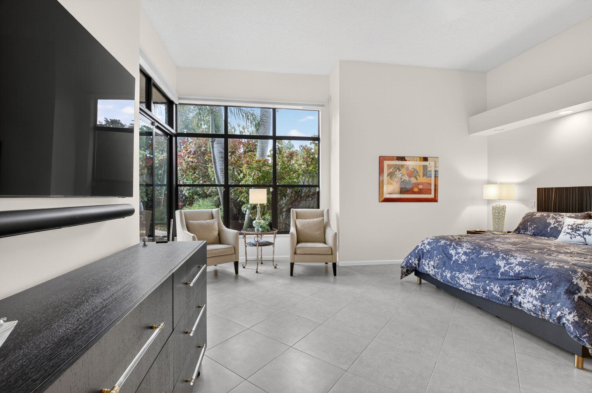 2462 Northwest 63rd Street Boca Raton, FL 33496 - Photo 15 of 41 a bedroom with a bed and a large window