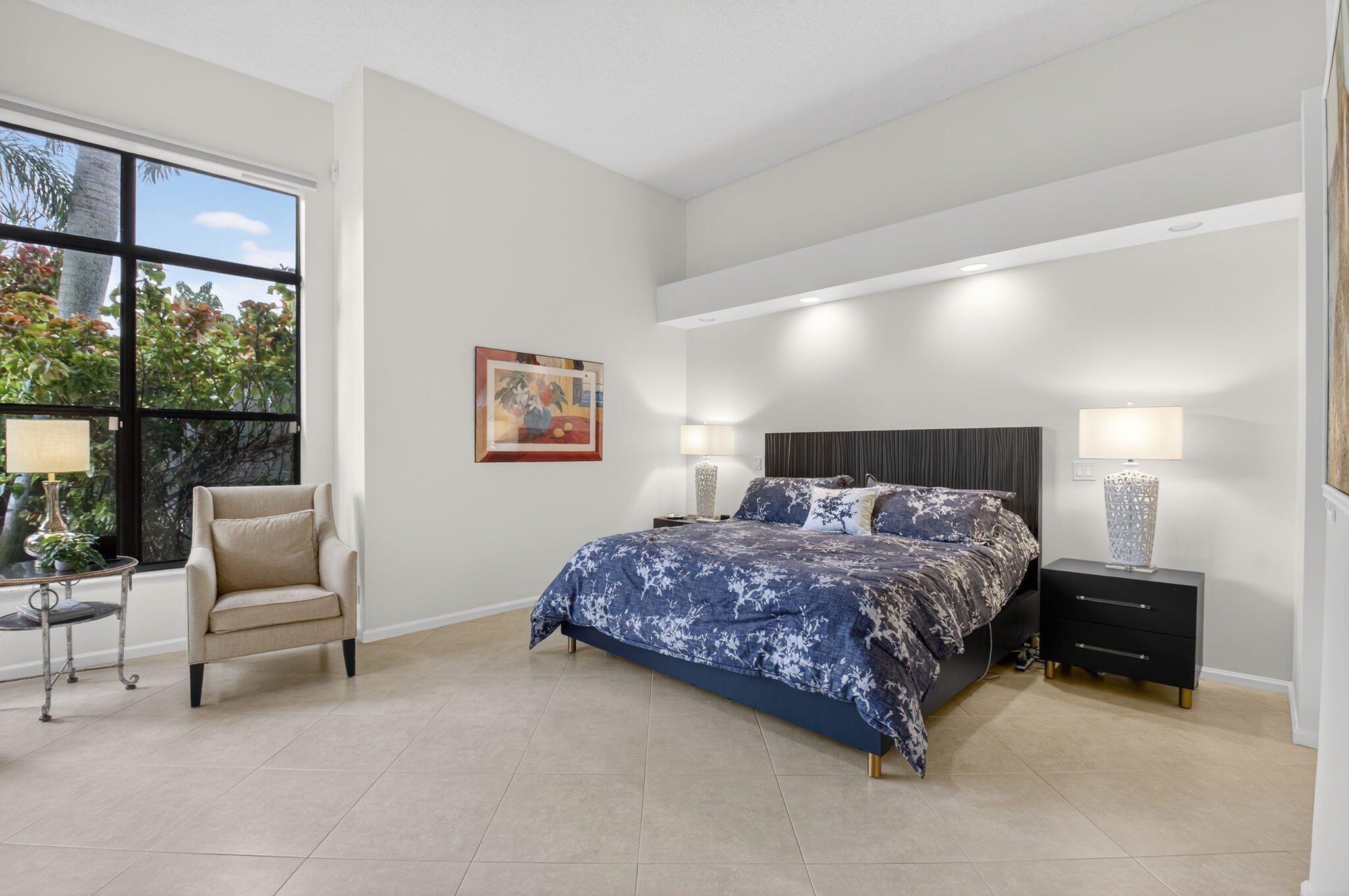 2462 Northwest 63rd Street Boca Raton, FL 33496 - Photo 16 of 41 a spacious bedroom with a bed and a large window
