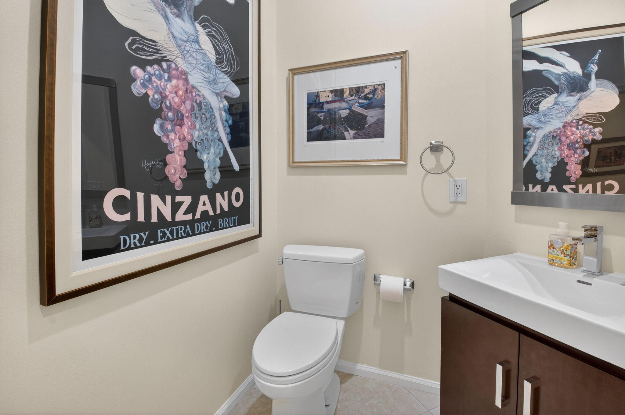 2462 Northwest 63rd Street Boca Raton, FL 33496 - Photo 23 of 41 a bathroom with a toilet a sink and a picture on the wall