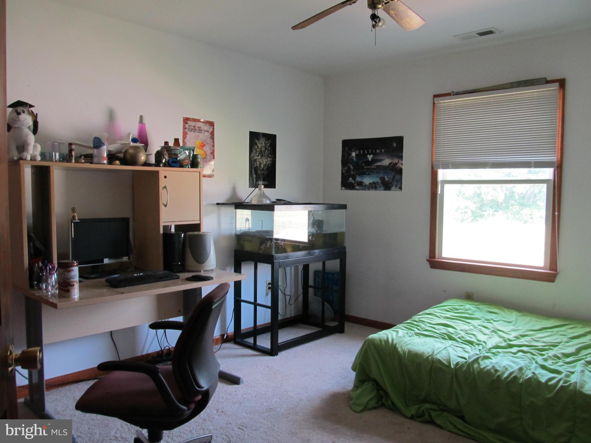 8997 Legion Road Denton, MD 21629 - Photo 14 of 25 a bedroom with a workspace
