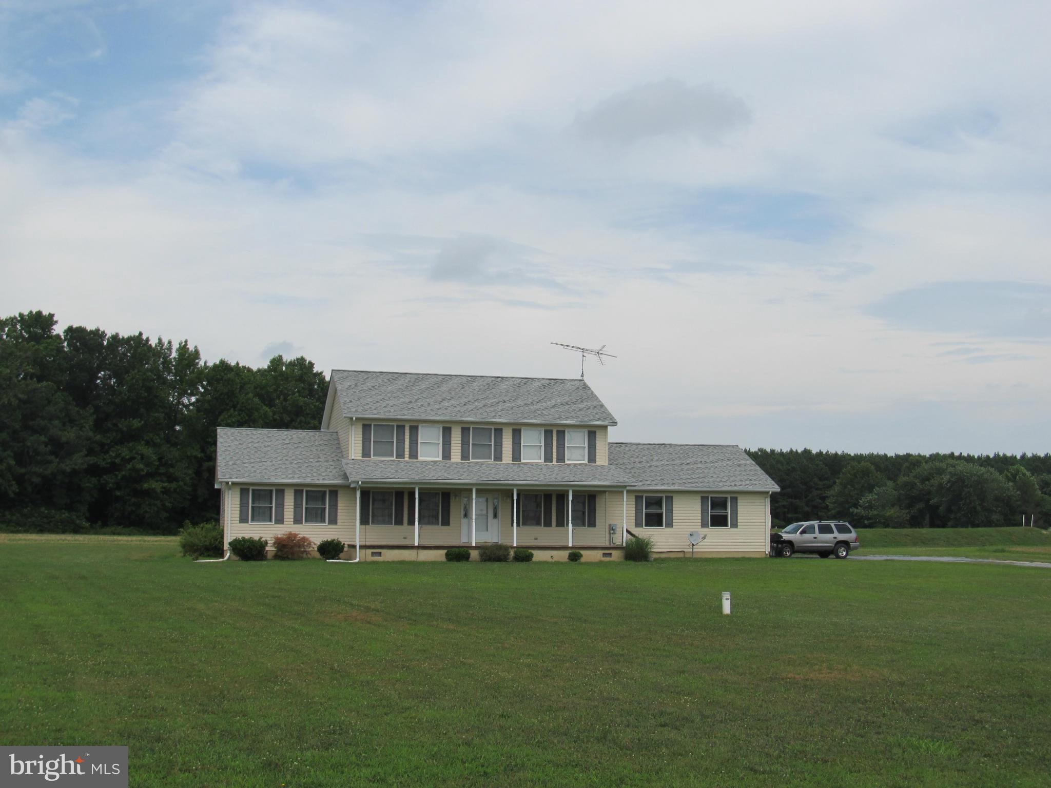 8997 Legion Road Denton, MD 21629 - Photo 22 of 25 a front view of a house with a garden
