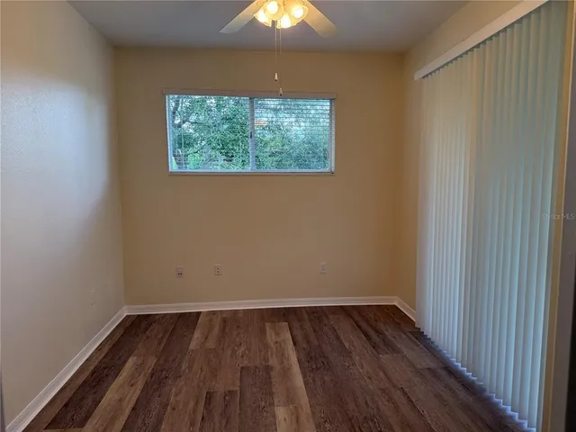 a view of room with hardwood floor and window