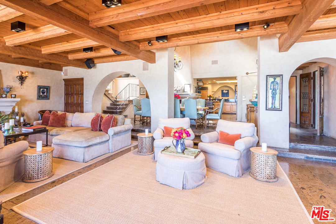 22102 Pacific Coast Highway Malibu, CA 90265 - Photo 13 of 36 a living room with furniture and a chandelier