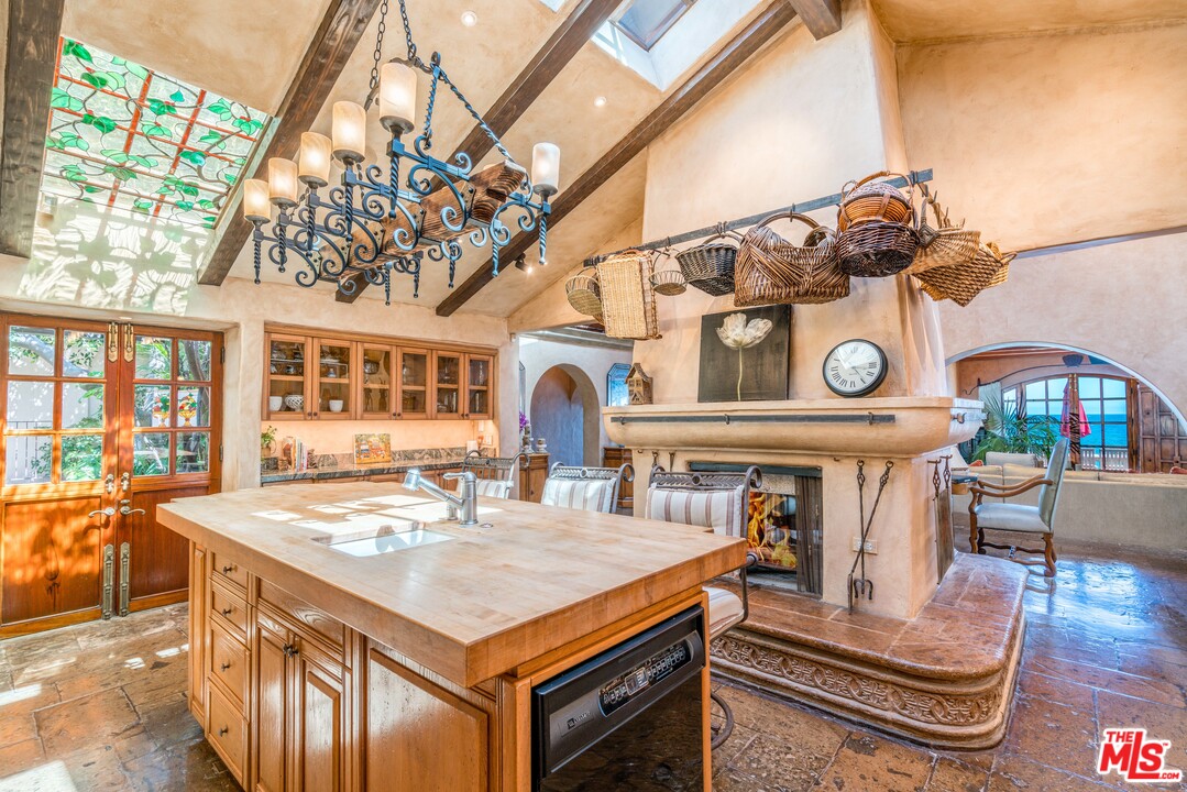 22102 Pacific Coast Highway Malibu, CA 90265 - Photo 17 of 36 a living room with furniture and a clock