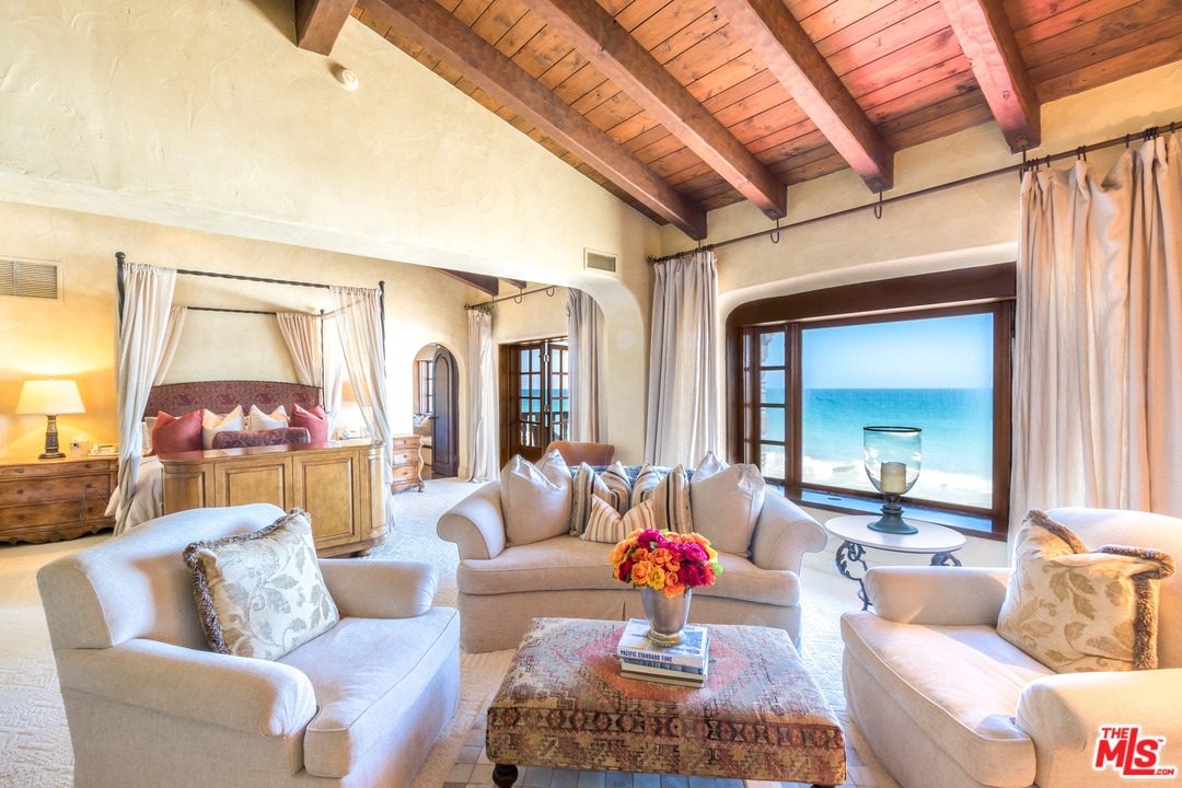 22102 Pacific Coast Highway Malibu, CA 90265 - Photo 20 of 36 a living room with furniture and a large window