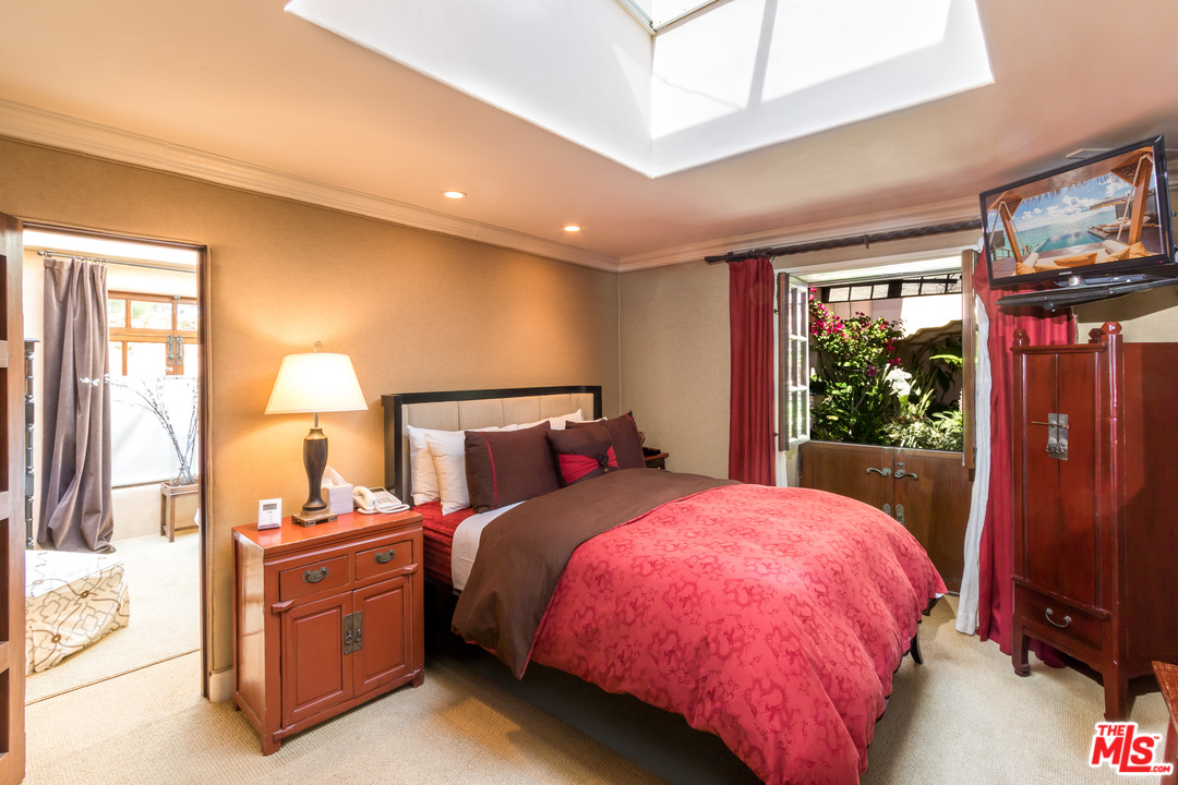 22102 Pacific Coast Highway Malibu, CA 90265 - Photo 26 of 36 a bed room with a bed and a window