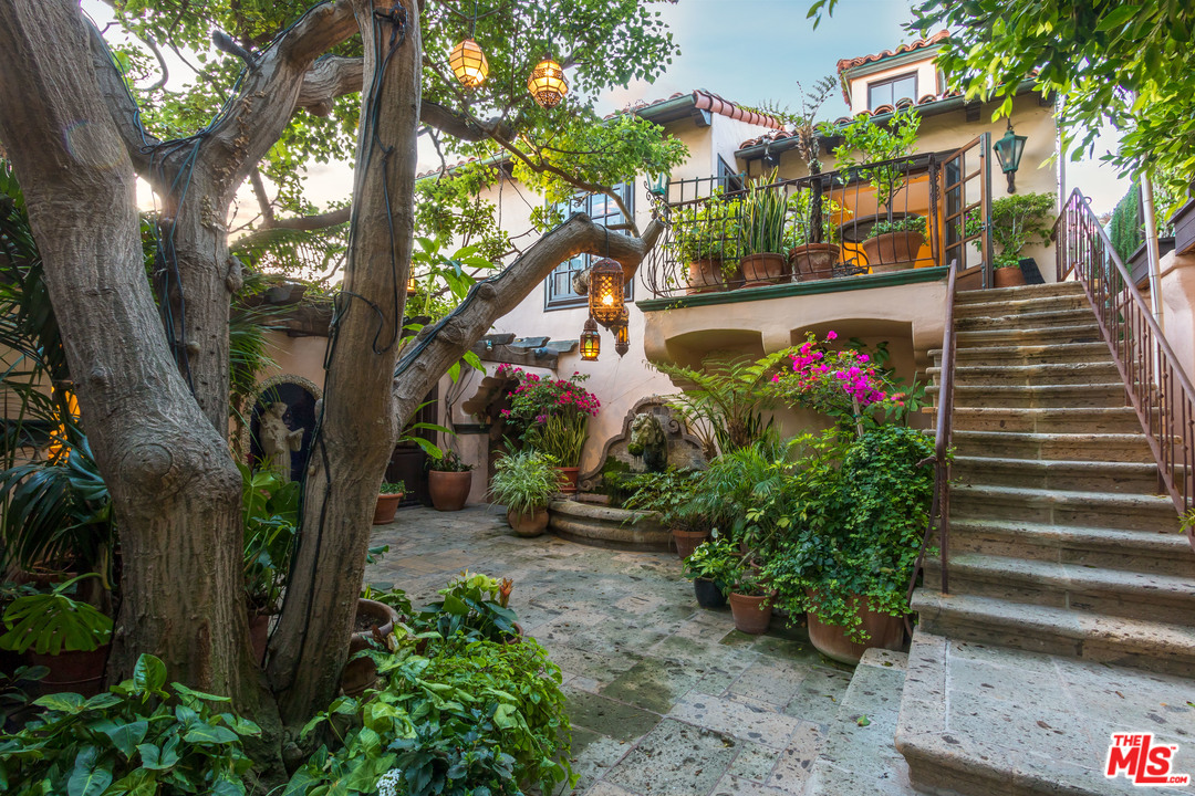 22102 Pacific Coast Highway Malibu, CA 90265 - Photo 28 of 36 a front view of a house with garden