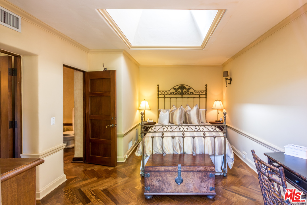 22102 Pacific Coast Highway Malibu, CA 90265 - Photo 31 of 36 a view of a bedroom with furniture and staircase