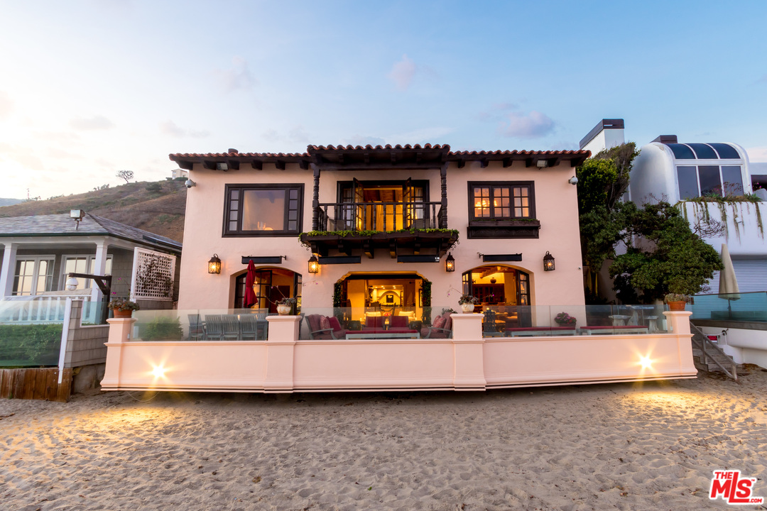 22102 Pacific Coast Highway Malibu, CA 90265 - Photo 33 of 36 a view of a house with more windows and a fireplace
