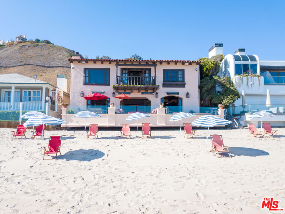 22102 Pacific Coast Highway Malibu, CA 90265 - Photo 9 of 36 a view of a swimming pool with a lounge chairs