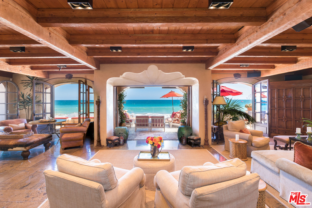 22102 Pacific Coast Highway Malibu, CA 90265 - Photo 10 of 36 a living room with furniture and a fireplace