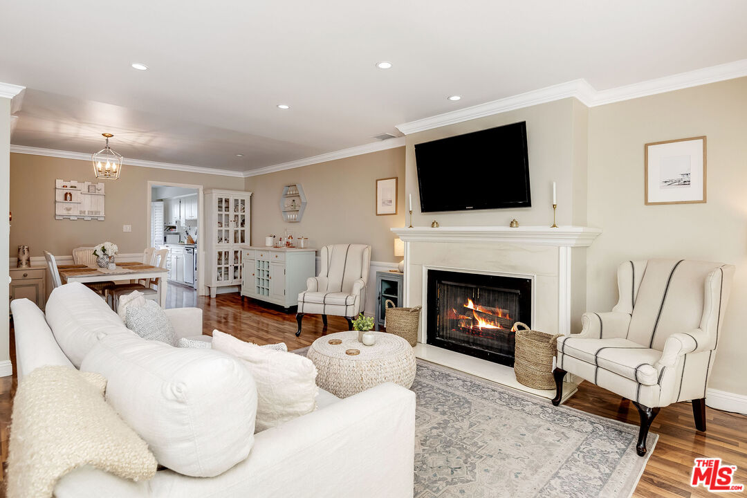 4443 Saugus Avenue, Unit 3 Sherman Oaks, CA 91403 - Photo 1 of 35 a living room with furniture fireplace and flat screen tv