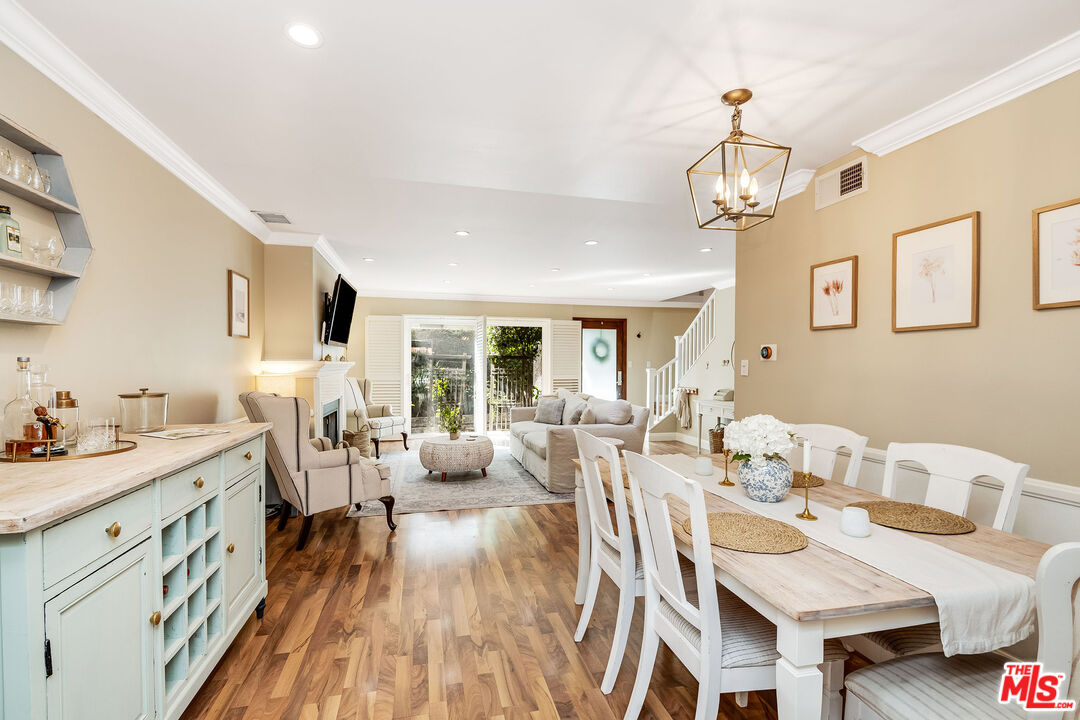 4443 Saugus Avenue, Unit 3 Sherman Oaks, CA 91403 - Photo 12 of 35 a view of a dining room with furniture window and wooden floor