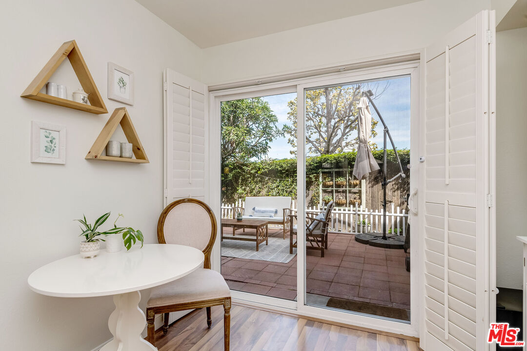 4443 Saugus Avenue, Unit 3 Sherman Oaks, CA 91403 - Photo 14 of 35 a dining room with furniture and window