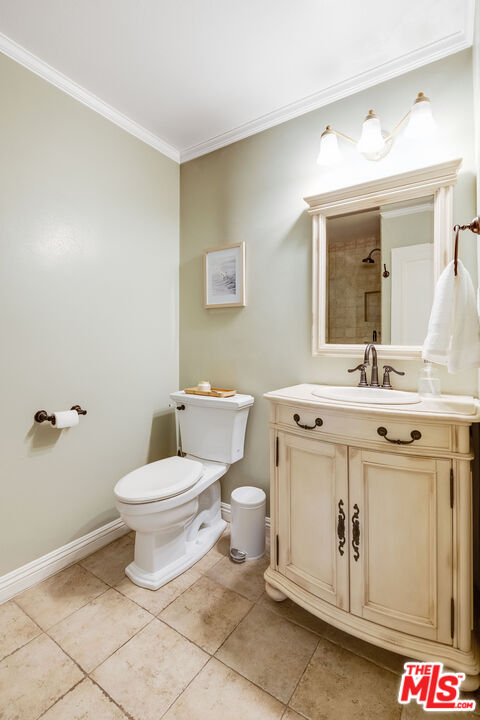 4443 Saugus Avenue, Unit 3 Sherman Oaks, CA 91403 - Photo 22 of 35 a bathroom with a sink a toilet and mirror