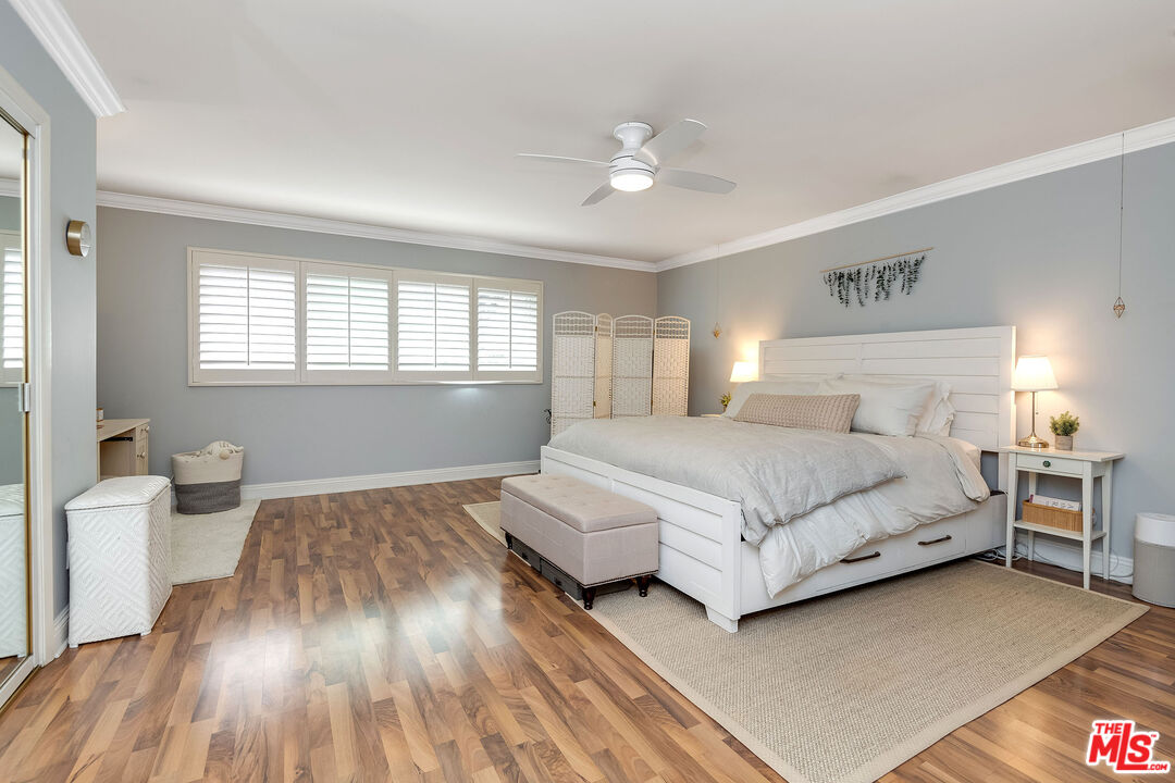 4443 Saugus Avenue, Unit 3 Sherman Oaks, CA 91403 - Photo 26 of 35 a bedroom with a bed and a table