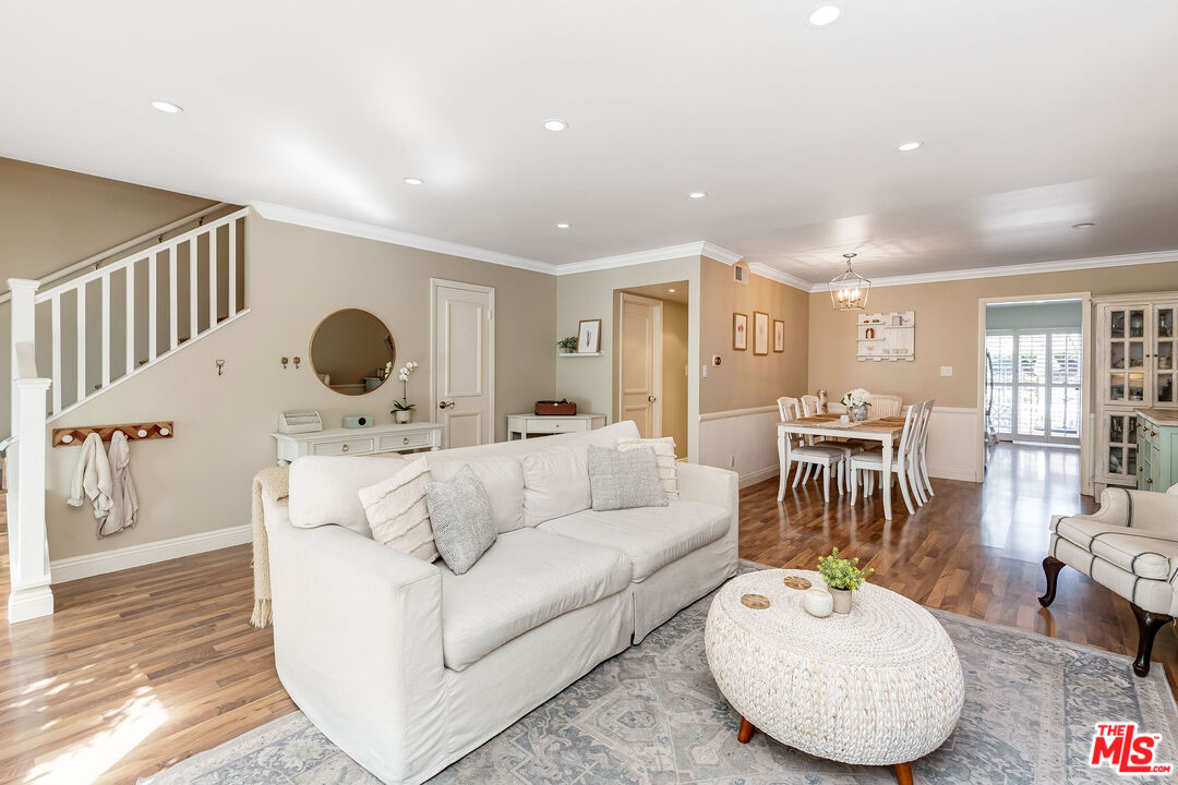4443 Saugus Avenue, Unit 3 Sherman Oaks, CA 91403 - Photo 10 of 35 a living room with furniture and a wooden floor