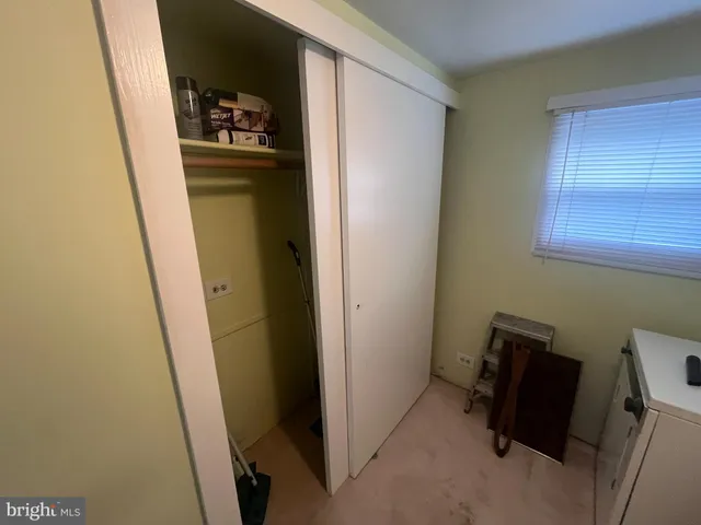 a bathroom with a double vanity sink mirror and bathtub
