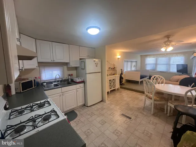 a kitchen with a table and chairs