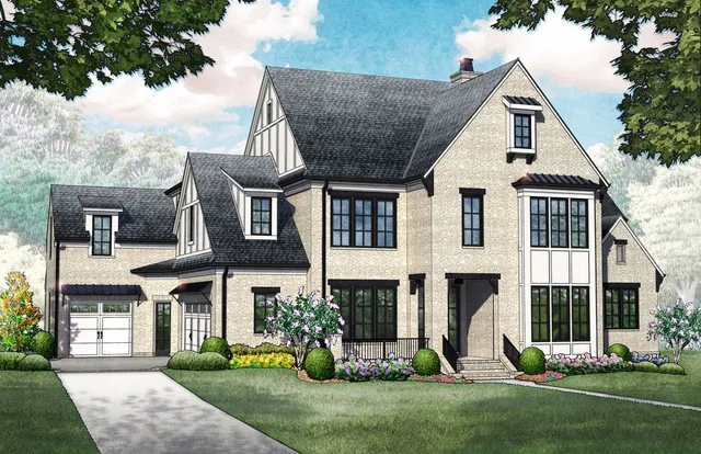 a front view of a house with a yard and trees