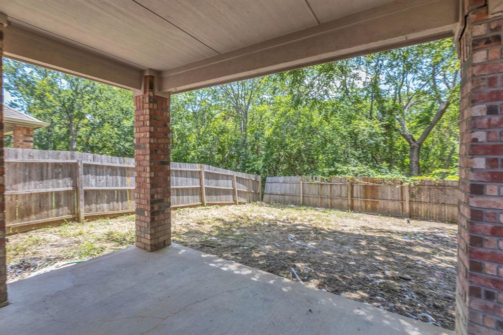 711 Parkplace Ridge Princeton, TX 75407 - Photo 15 of 15 a view of backyard with green space and wooden fence
