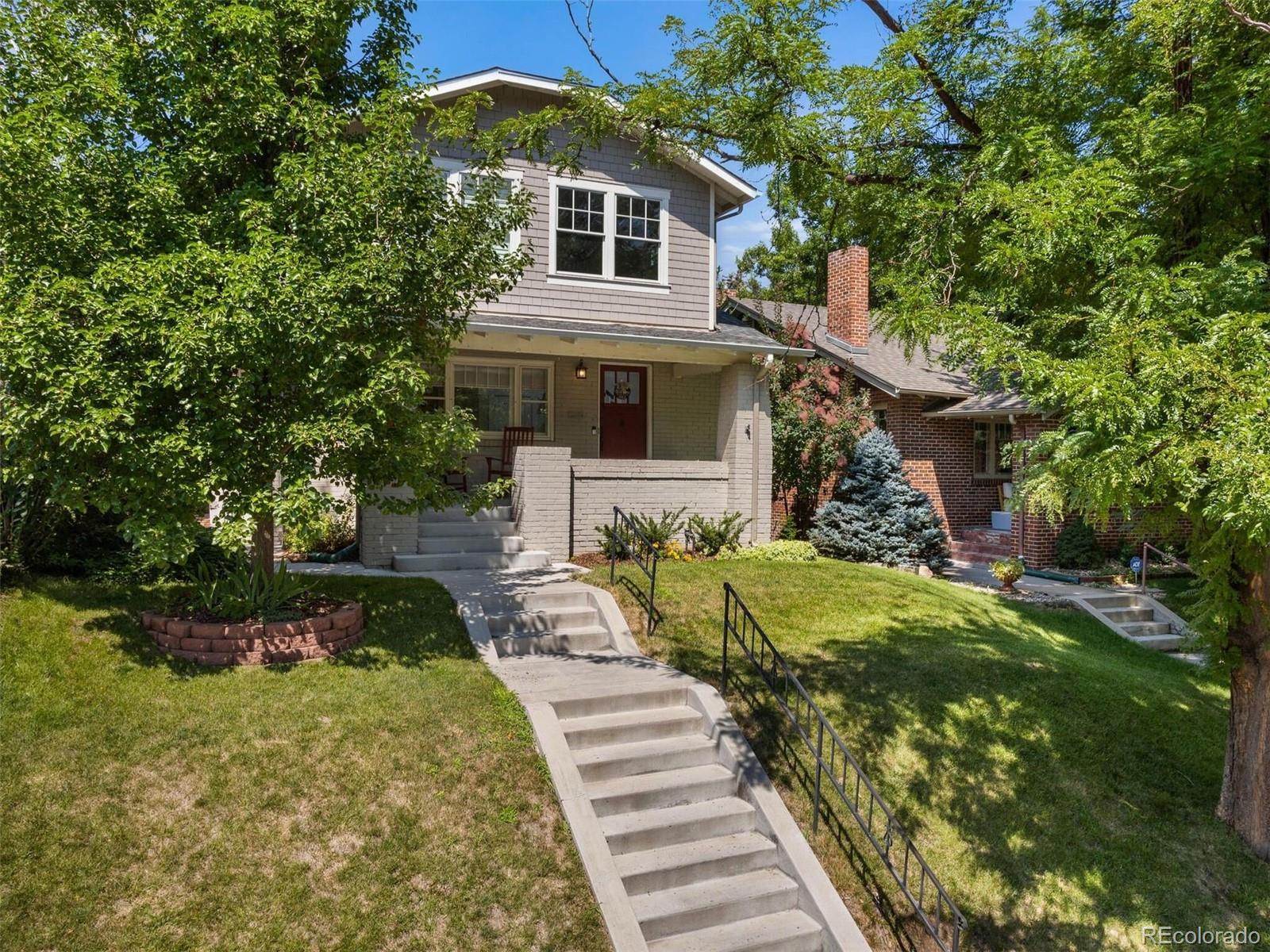 643 Jackson Street Denver, CO 80206 - Photo 2 of 40 a front view of a house with garden