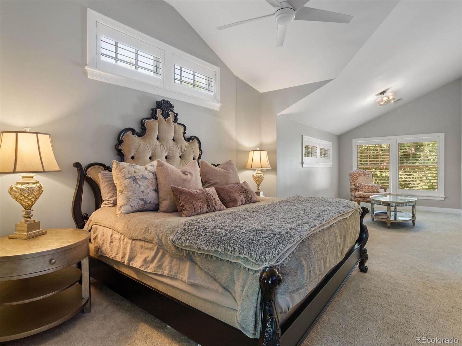 643 Jackson Street Denver, CO 80206 - Photo 23 of 40 a spacious bedroom with a bed and window