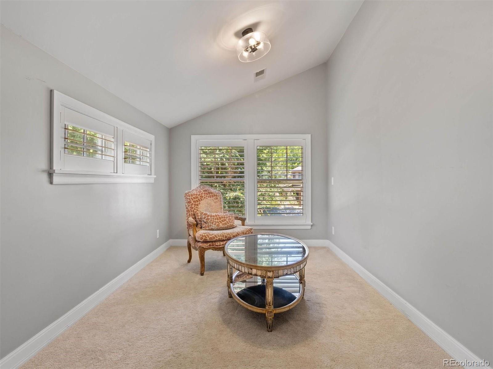 643 Jackson Street Denver, CO 80206 - Photo 25 of 40 a living room with furniture and a window