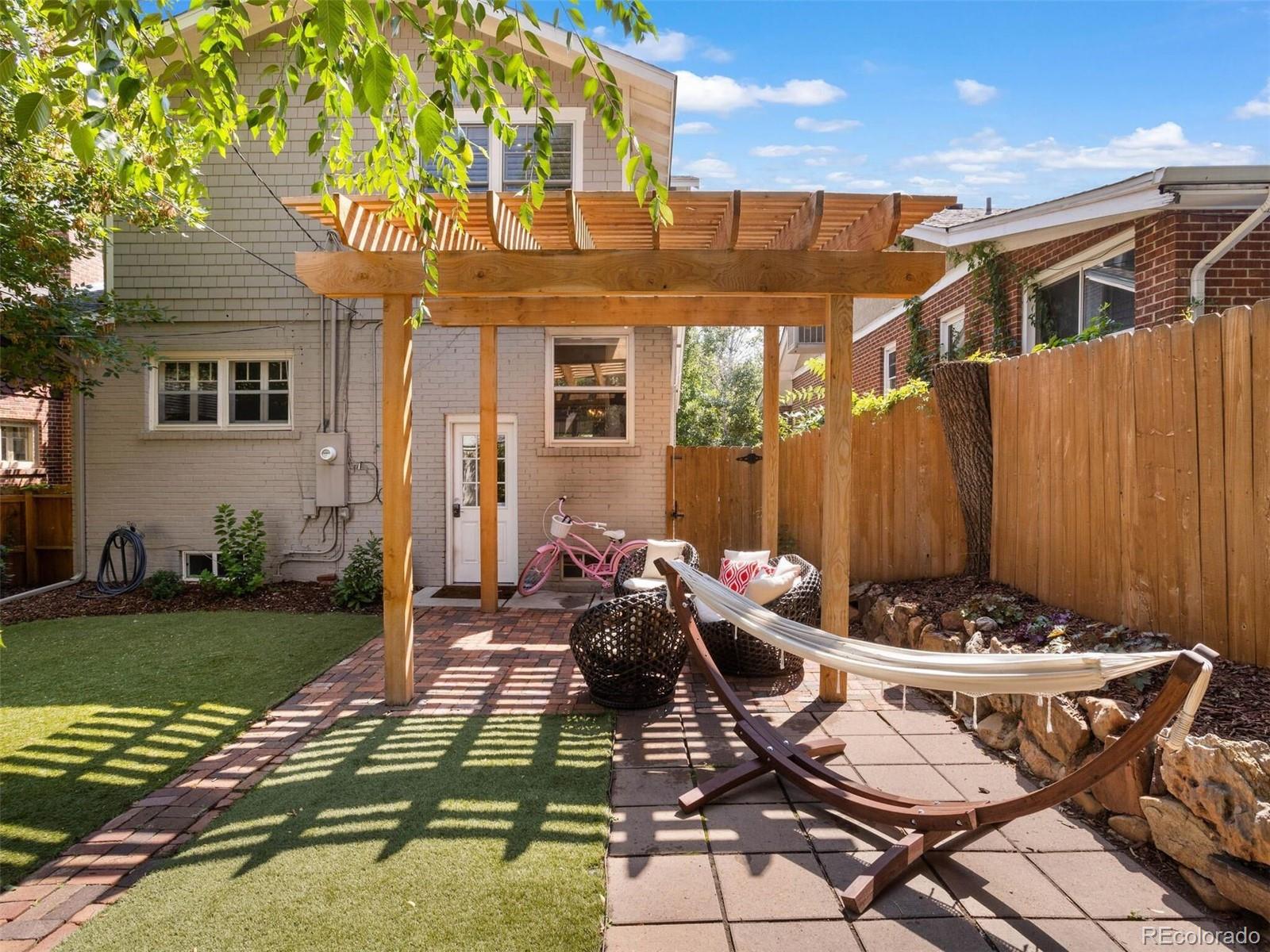 643 Jackson Street Denver, CO 80206 - Photo 36 of 40 a view of a patio with table and chairs with plants