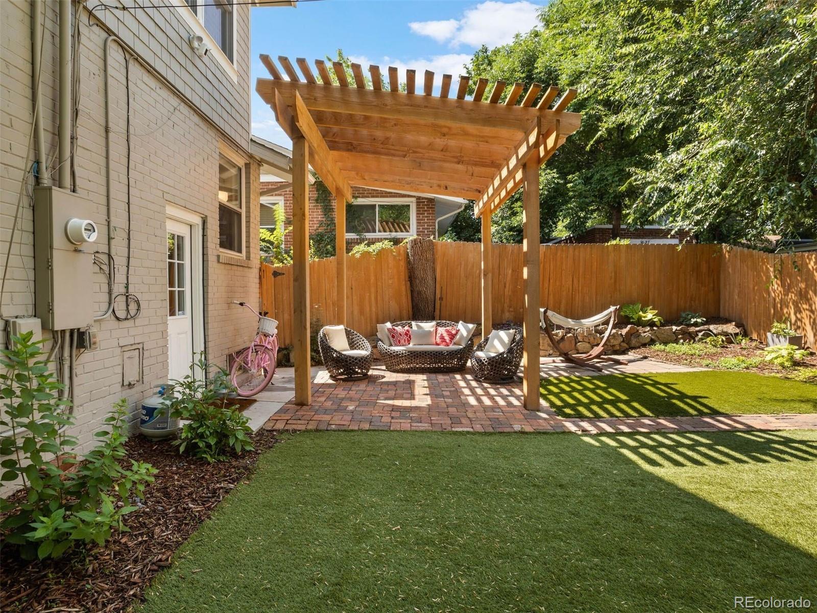 643 Jackson Street Denver, CO 80206 - Photo 38 of 40 a view of a chairs and table in backyard