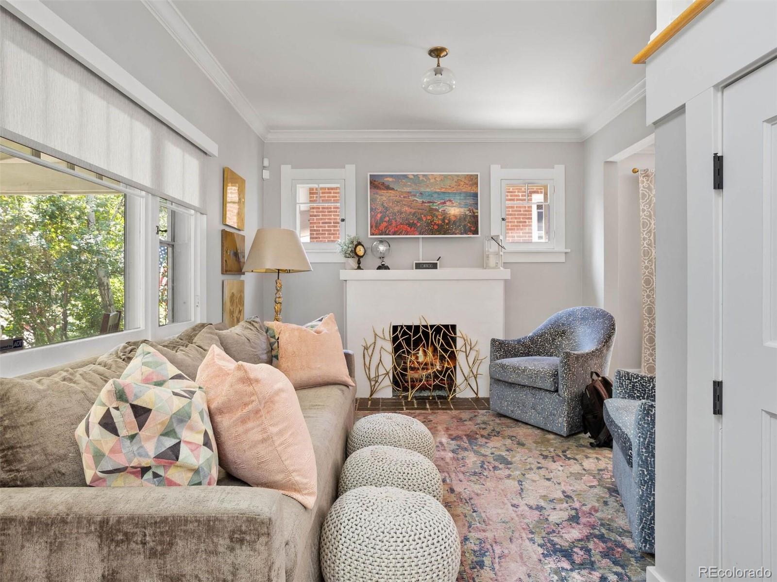 643 Jackson Street Denver, CO 80206 - Photo 7 of 40 a living room with furniture and a flat screen tv
