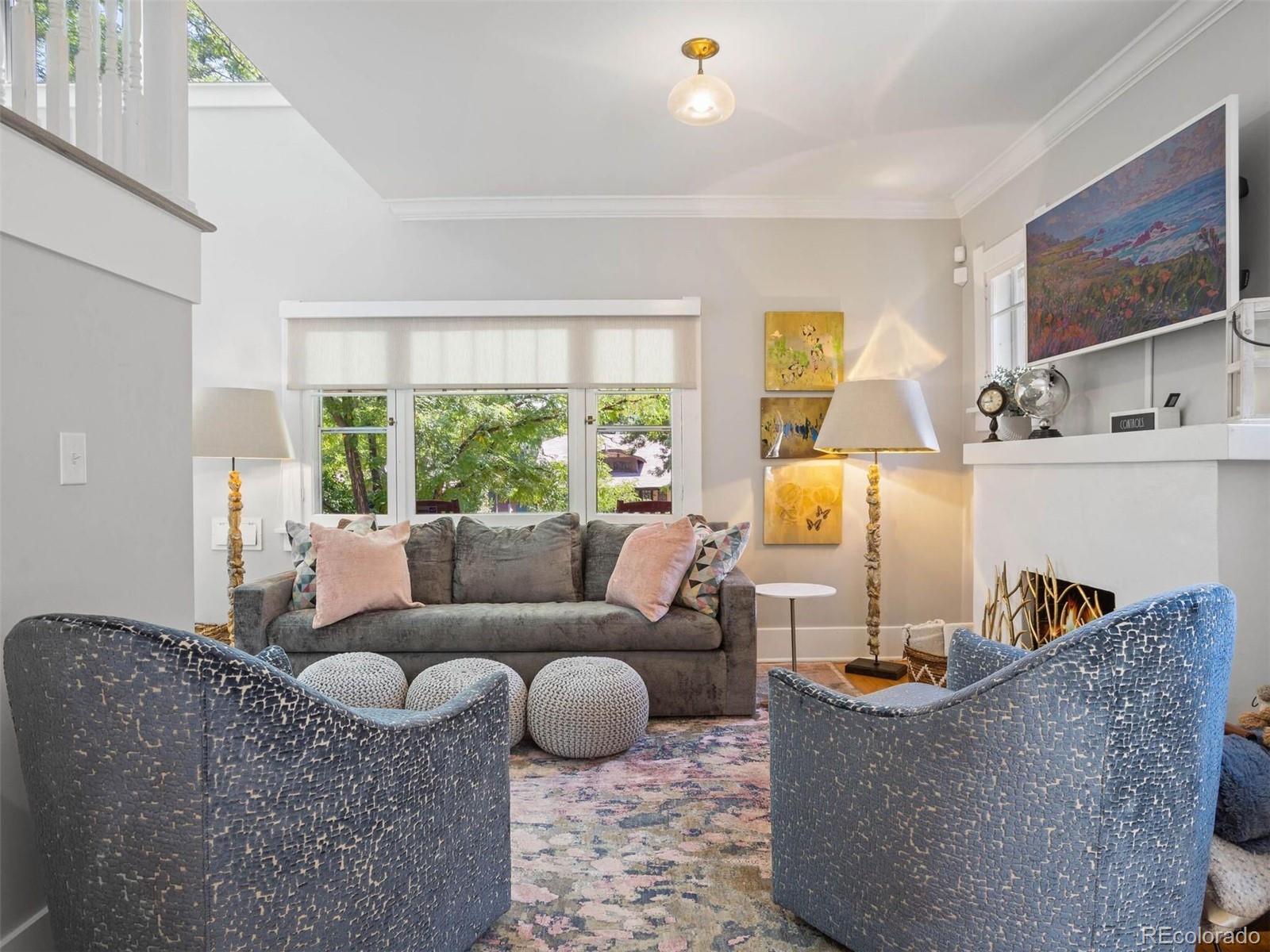 643 Jackson Street Denver, CO 80206 - Photo 8 of 40 a living room with furniture and a flat screen tv