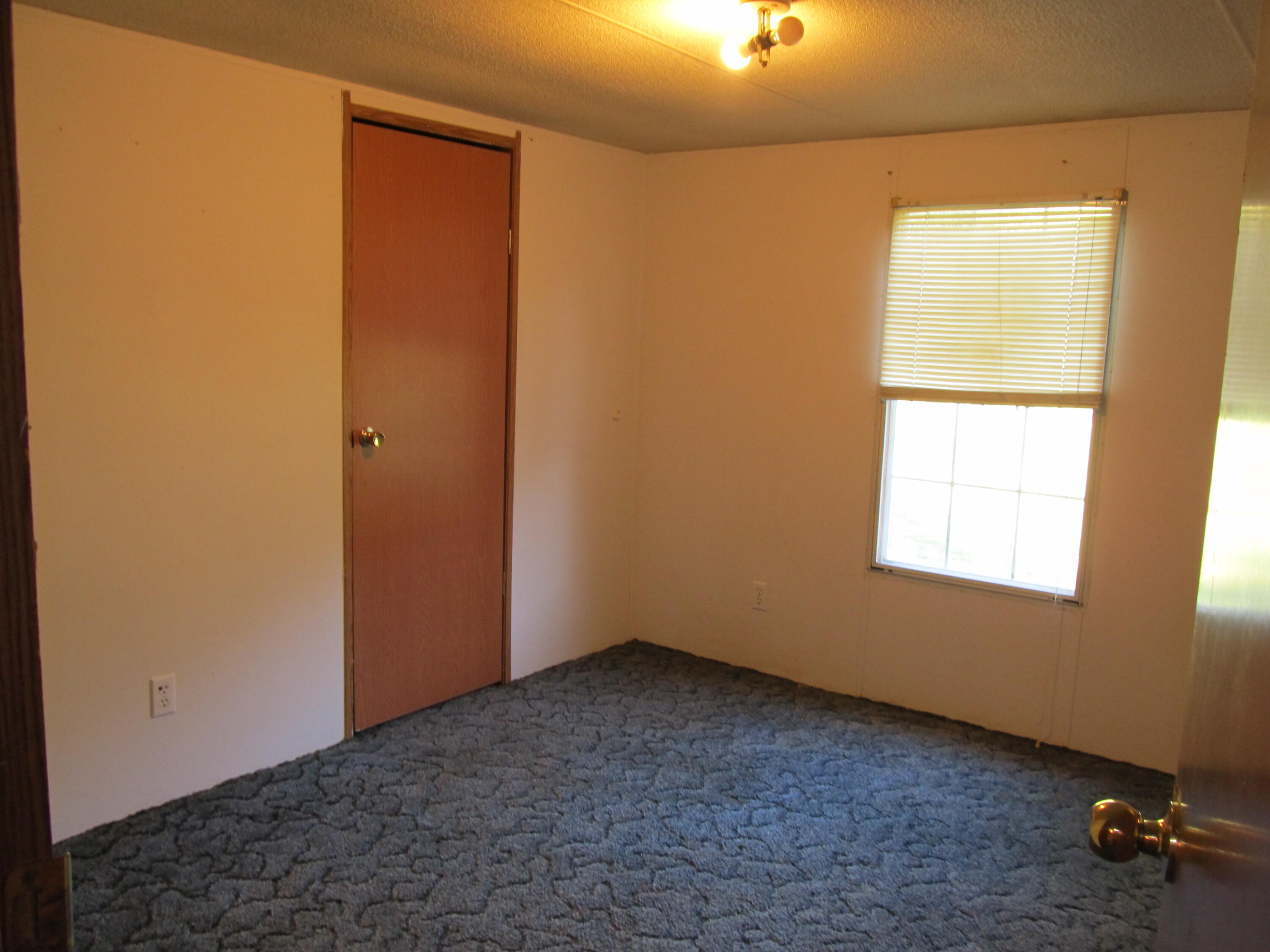 211 River Road Samson, AL 36477 - Photo 13 of 23 an empty room with a window