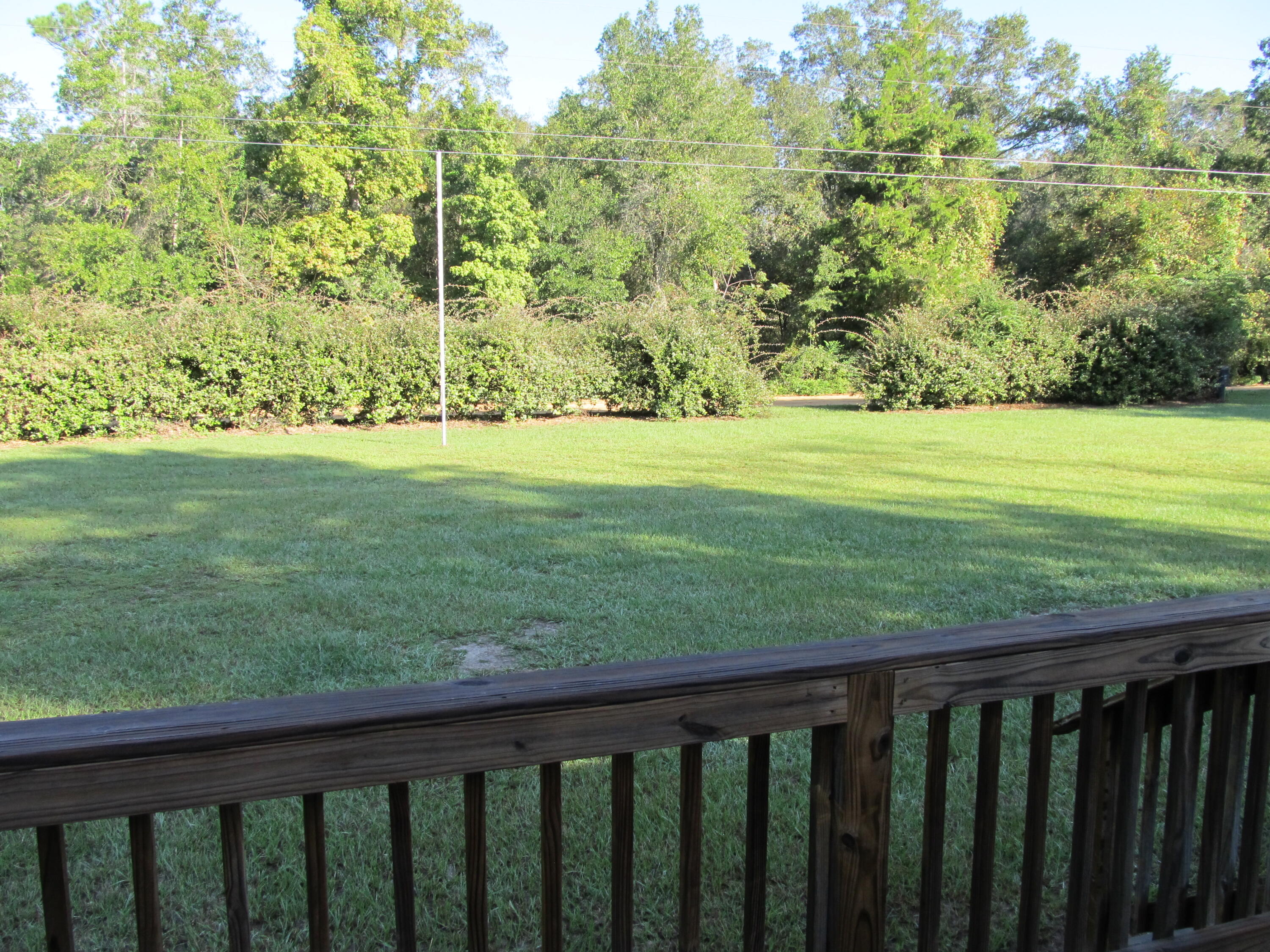 211 River Road Samson, AL 36477 - Photo 15 of 23 a balcony with an outdoor space