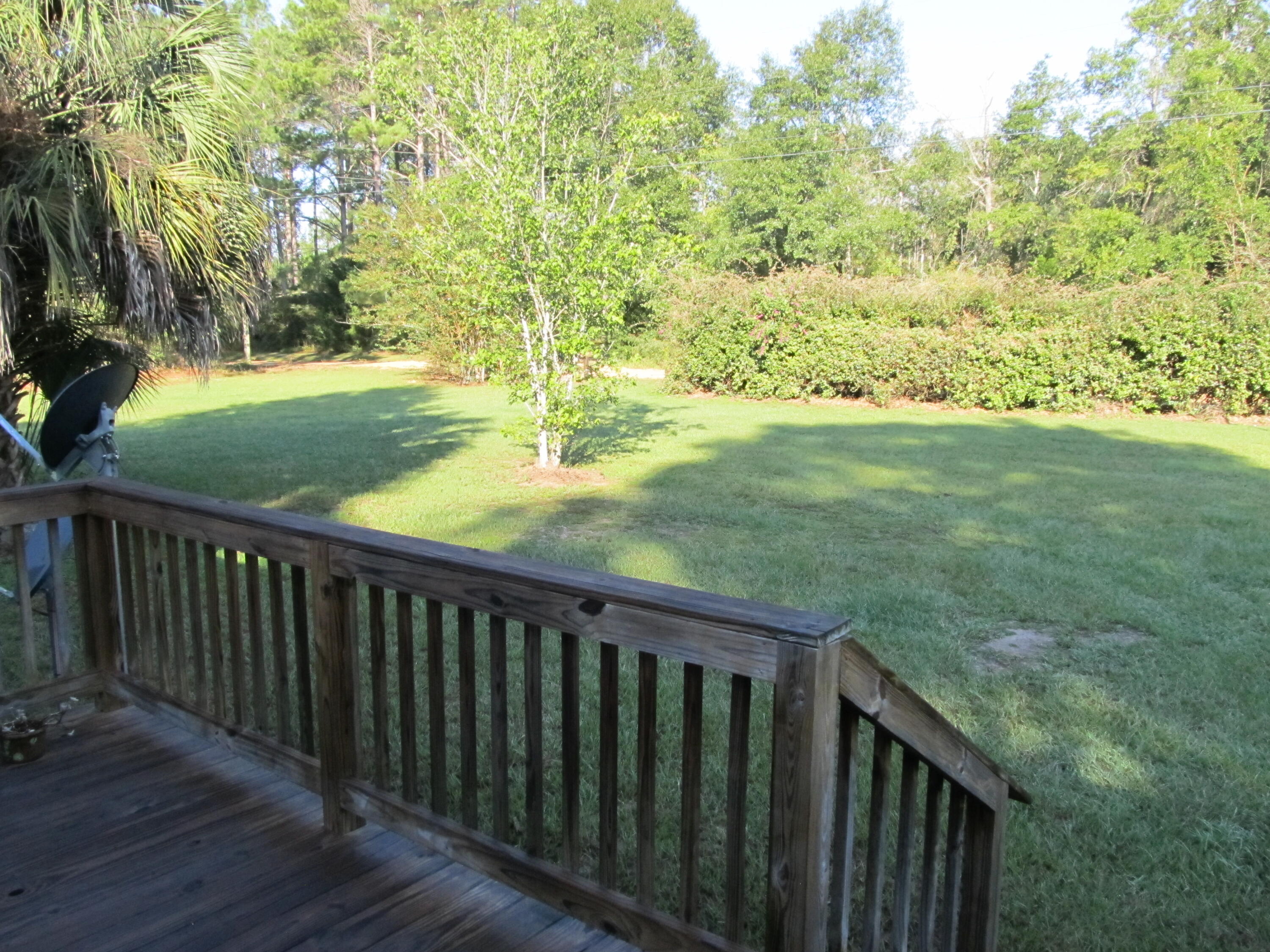 211 River Road Samson, AL 36477 - Photo 16 of 23 a balcony with an outdoor space