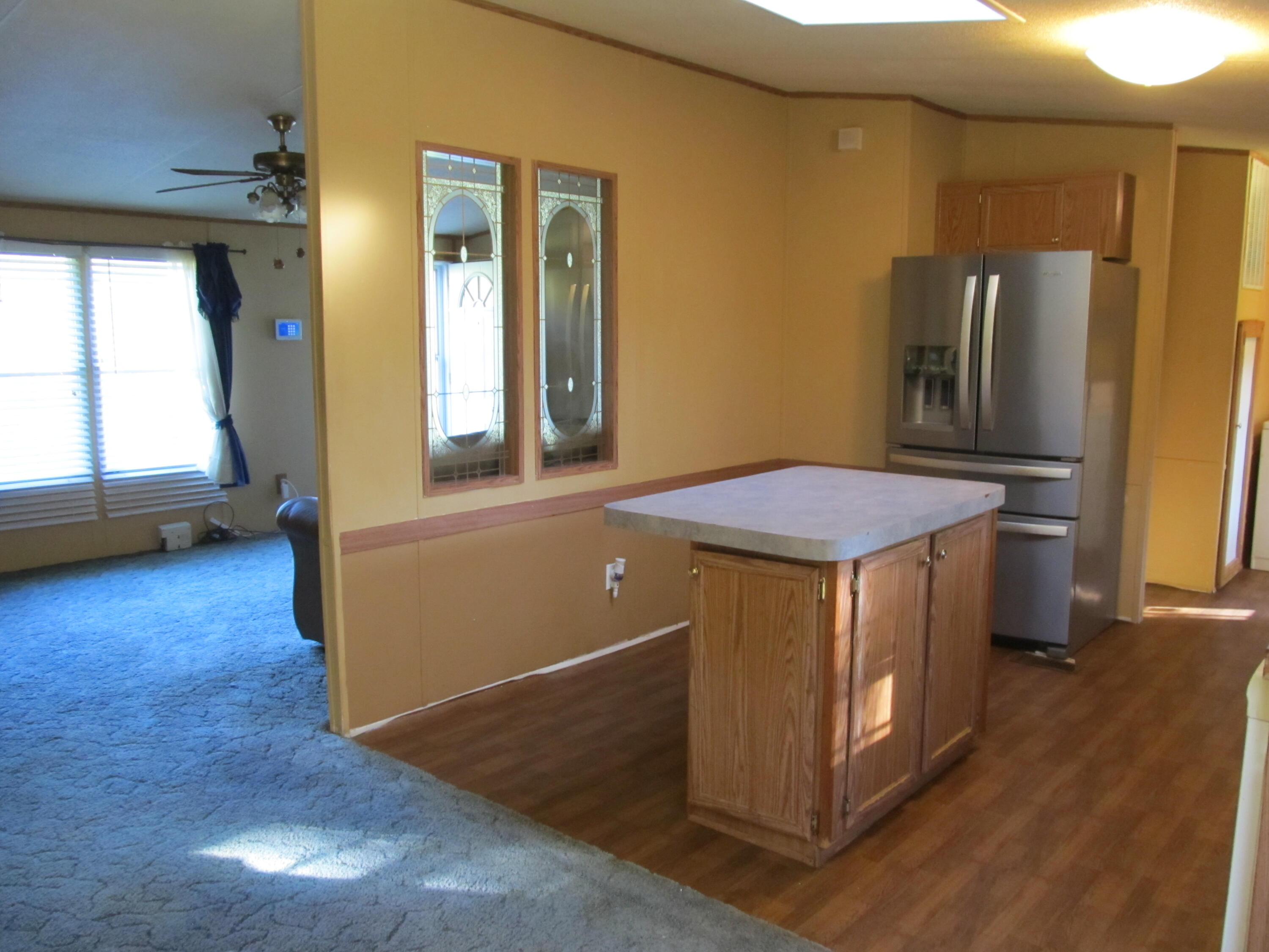 211 River Road Samson, AL 36477 - Photo 6 of 23 a view of kitchen with furniture and wooden floor