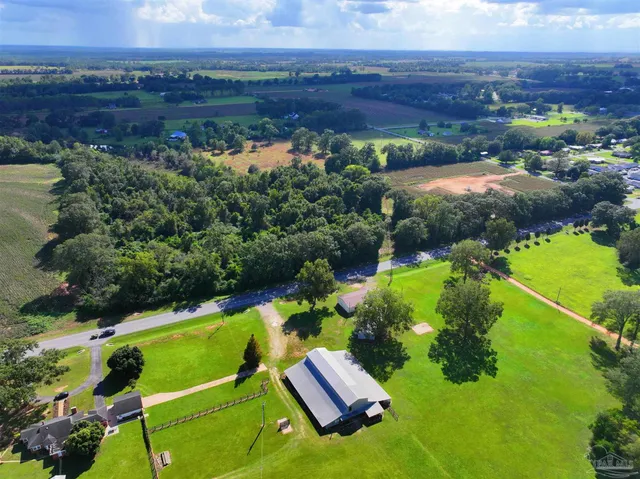 an aerial view of a house with a garden